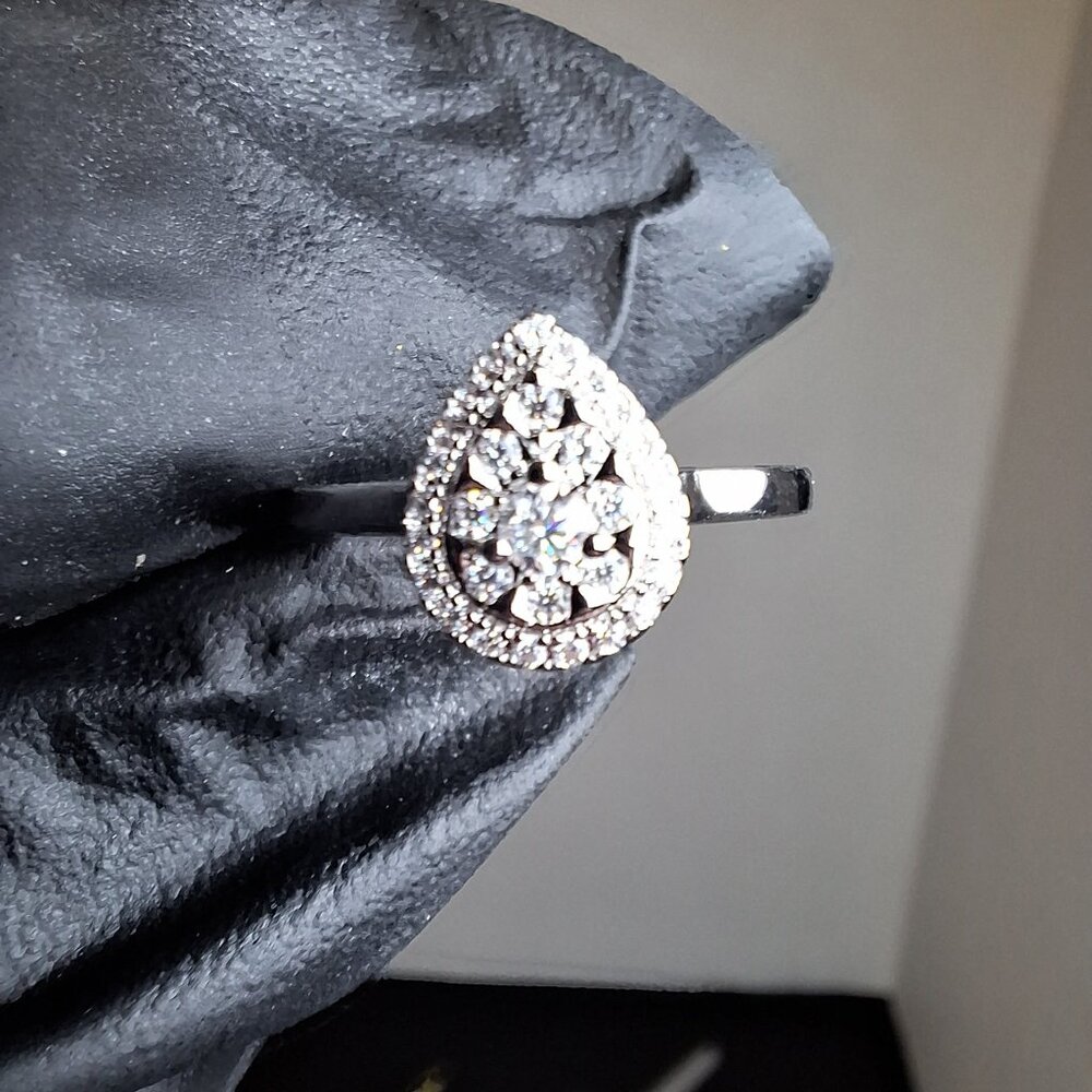 0.24ctw Rhodium Over Silver Filled Moissanite Size 6 ring